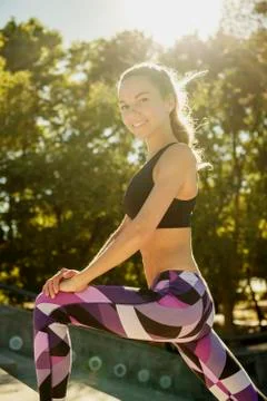 Gril stretching doing exercise outdoors Foto stock