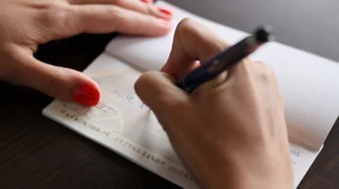 Gril Writing a Check Stock Footage 33193196