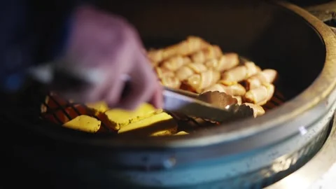 A grill with bacon and cheese on it Stock Footage 295370602