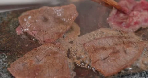 Grill beef on the hot stone Stock Footage 138621328