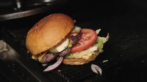 GRILL Chef preparing hamburger in restaurant kitchen Stock Footage 208380931