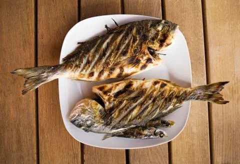 Grill fish on plate. Stock Photos