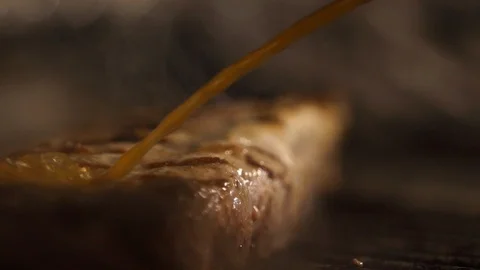 Grill flare while saucing ribs Stock Footage 127404437