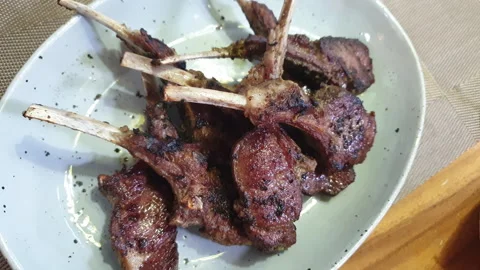 Grill lamb chop with bone herb roasted meal dinner Stock Footage 289280823