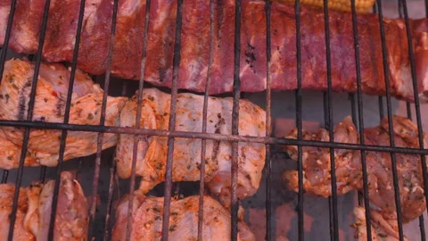 A grill with meat and corn on it Stock Footage 276343998