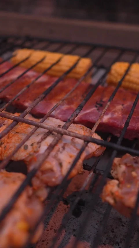 A grill with meat and corn on it Stock Footage 276344000