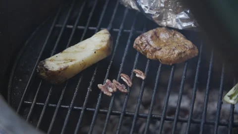 A grill with meat and potatoes on it Stock Footage 301630145