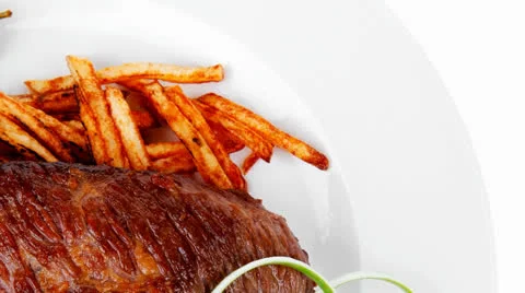 Grill meat on potato chips Stock Footage