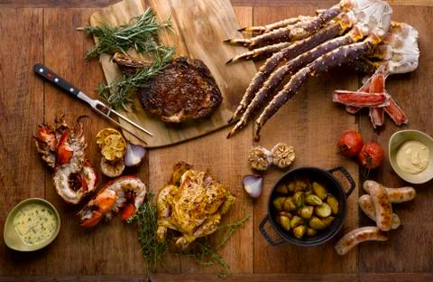 The grill mezza table meal with roasted chicken, beef, lobsters, sausages, ki Stock Photos