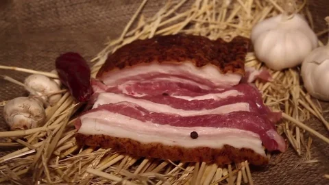Grill pan with a steak. Bacon wrapped asparagus and garlic. Stock Footage 81481742