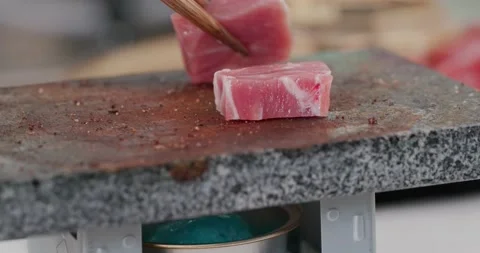 Grill pork on the hot stone Stock Footage 138058951