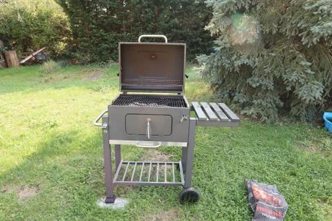 A grill is ready for the steaks Stock Photos