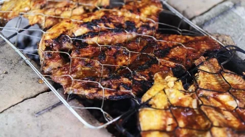 A grill with two pieces of fish on it 스톡 동영상 319295870