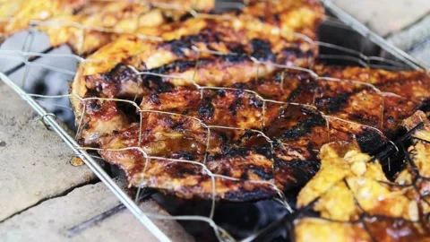 A grill with two pieces of fish on it 스톡 동영상 319295930