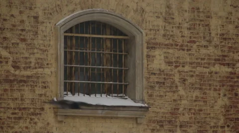 Grille on window of city prison Stock Footage