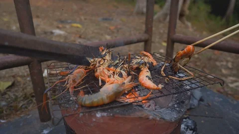 Grilled and roasted squid on fire for cooking sea food Stockbeeldmateriaal 123926944