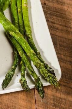 Grilled asparagus spears on plate 写真素材