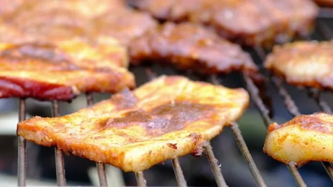 Grilled bacon on the barbecue Stock Footage 132828221