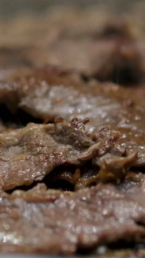 Grilled bacon strips capture essence of sizzling goodness, ready to be devoured Stock Footage 302804458