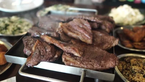 Grilled barbecue beef steak upon the grill. Luxury restaurant. Stock Footage 138855153
