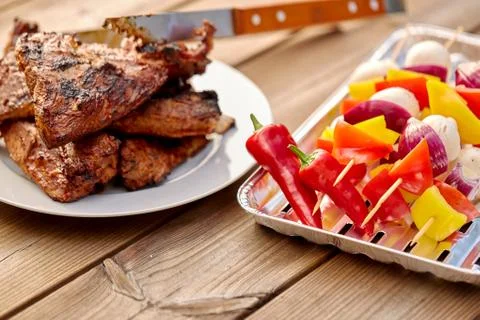 Grilled barbecue meat stack on plate Stock Photos