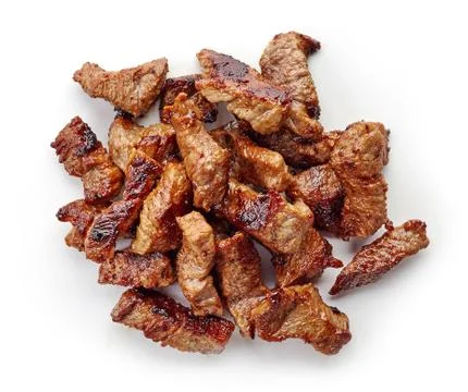 Grilled beef chunks isolated on white, from above Stock Photos