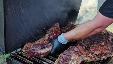 Grilled Beef Cuts Cooking on Barbecue Grill in Paraguay Видео 335602529