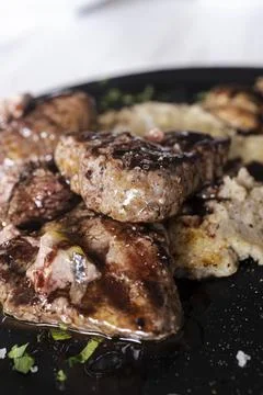 Grilled beef medallions with mashed potatoes for dinner Stock Photos