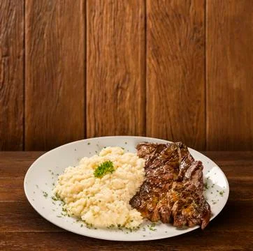 Grilled beef steak and risotto Stock Photos