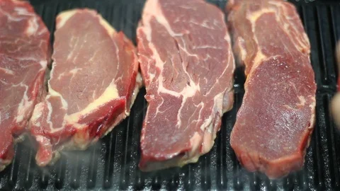 Grilled beef steak on cast iron frying pan Stock Footage 109073372