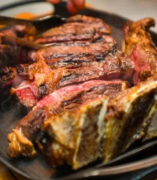 Grilled beef steak, close-up, selective focus Stock Photos