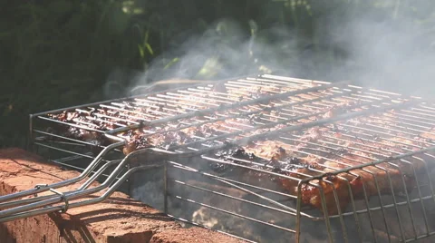 Grilled beef steak on the grilling pan outdoors Stock Footage 64092735