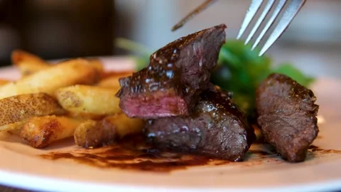 Grilled beef steak medium rare degree of doneness close-up. Video stock 291988742