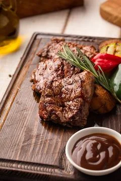 Grilled beef steak portion with vegetables Stock Photos