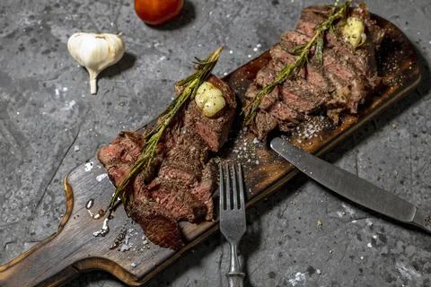 Grilled beef steak with red wine, herbs and spices Stock Photos