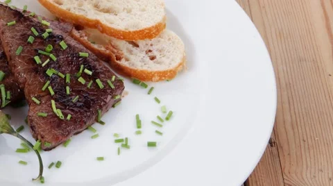 Grilled beef steak served on white plate Stock Footage