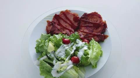 Grilled beef steak on a white platter Stock Footage 242452543