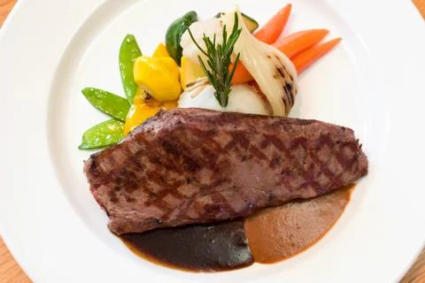 Grilled beef steaks Stock Photos