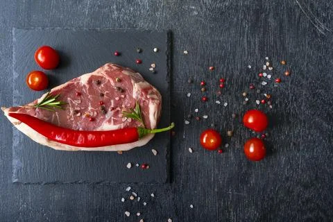Grilled beef steaks on stone background with copy space for your text concept Stock Photos