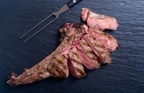 Grilled beef tomahawk steak Stock Photos