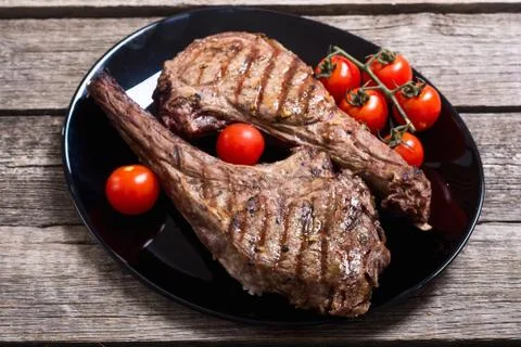 Grilled beef tomahawk steak Stock Photos