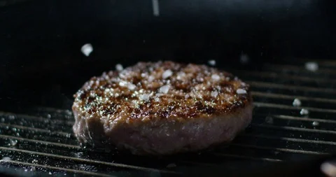 Grilled burger with salt 4k Stock Footage 85835871