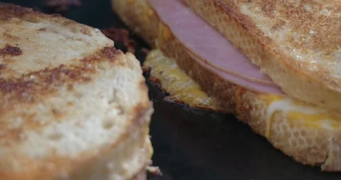 Grilled cheese melting on flat top grill outside Stock Footage 282765505