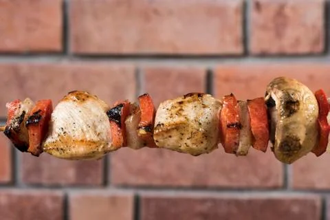 Grilled Chicken and Vegetable Skewers with bell peppers, zucchini, onion and  Stock Photos