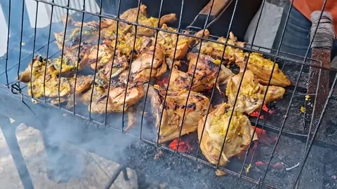 Grilled chicken is being grilled over charcoal Stock Footage 329286972
