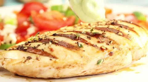 Grilled chicken breast being served with wasabi paste Stock Footage 24672040