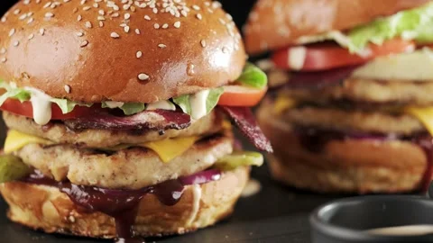 Grilled chicken burger with double cutlet, dolly shot. Fast food set. Stock Footage 147292884