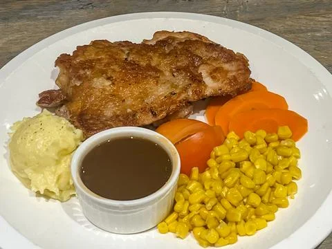 Grilled chicken chop served with mashed potatoes Stock Photos