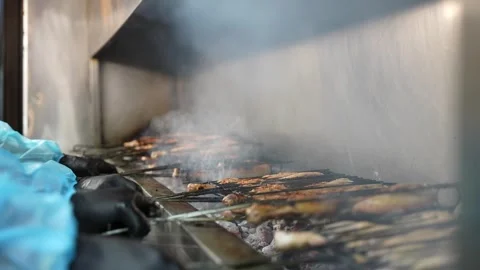 Grilled Chicken on Coal with hands of cheff HD Stock Footage 272449624