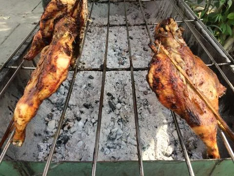 Grilled chicken cooked on bbq grid Stock Photos